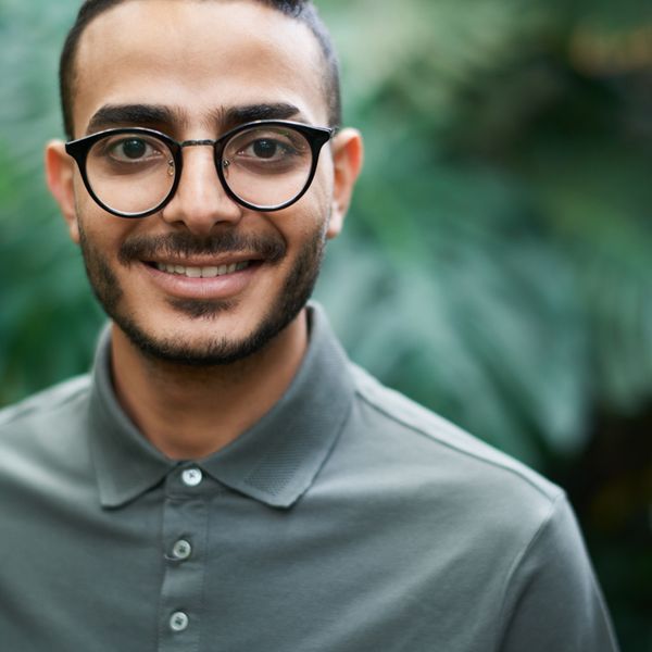 Man with glasses smiling