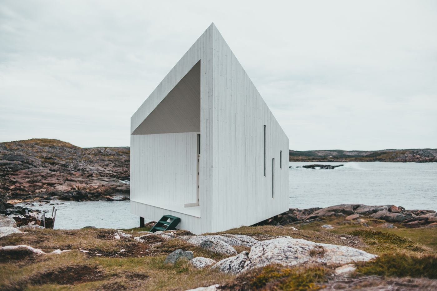 The white timber peak of Havhuset against a pale sky