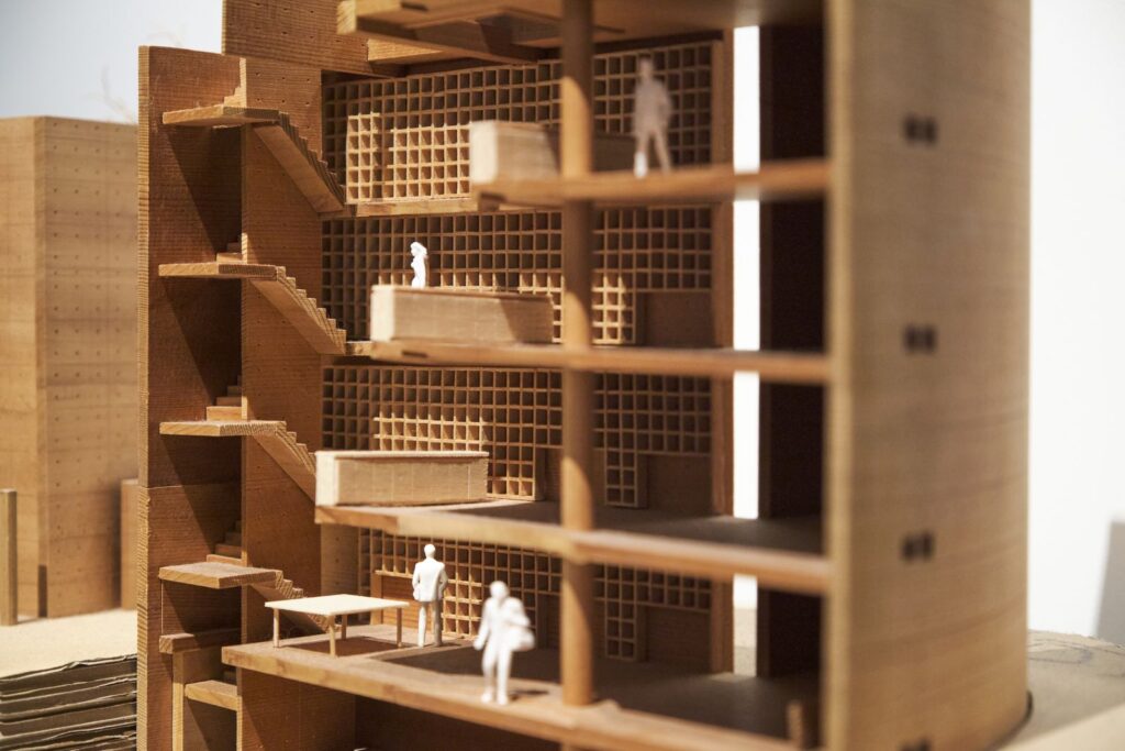 A timber section model with tiny figures