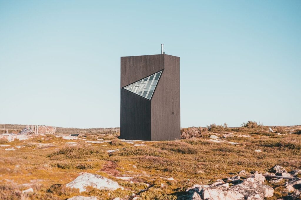 A dark timber tower on open autumn moorland
