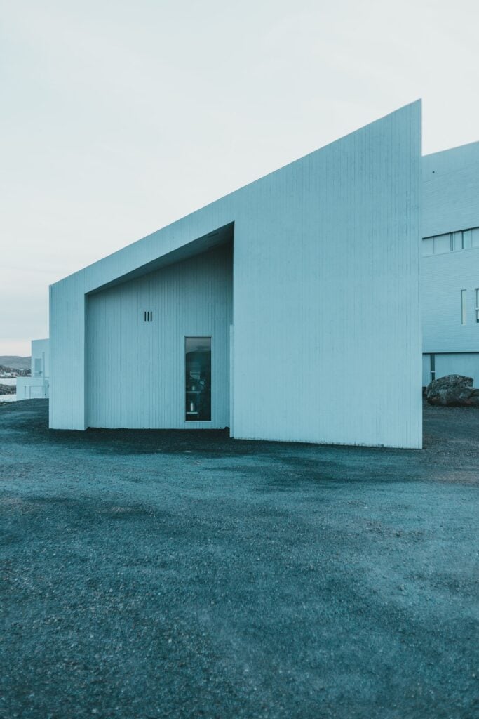 The front of Havhuset, a white angular studio with a single dark door