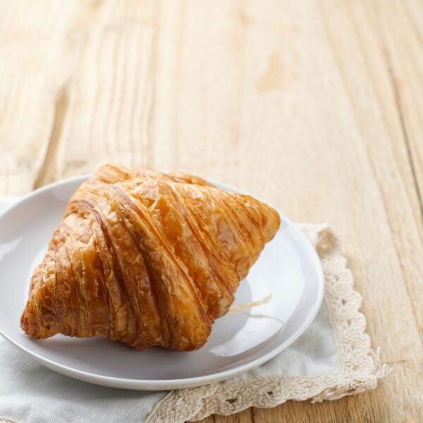 Butter croissant on a white plate