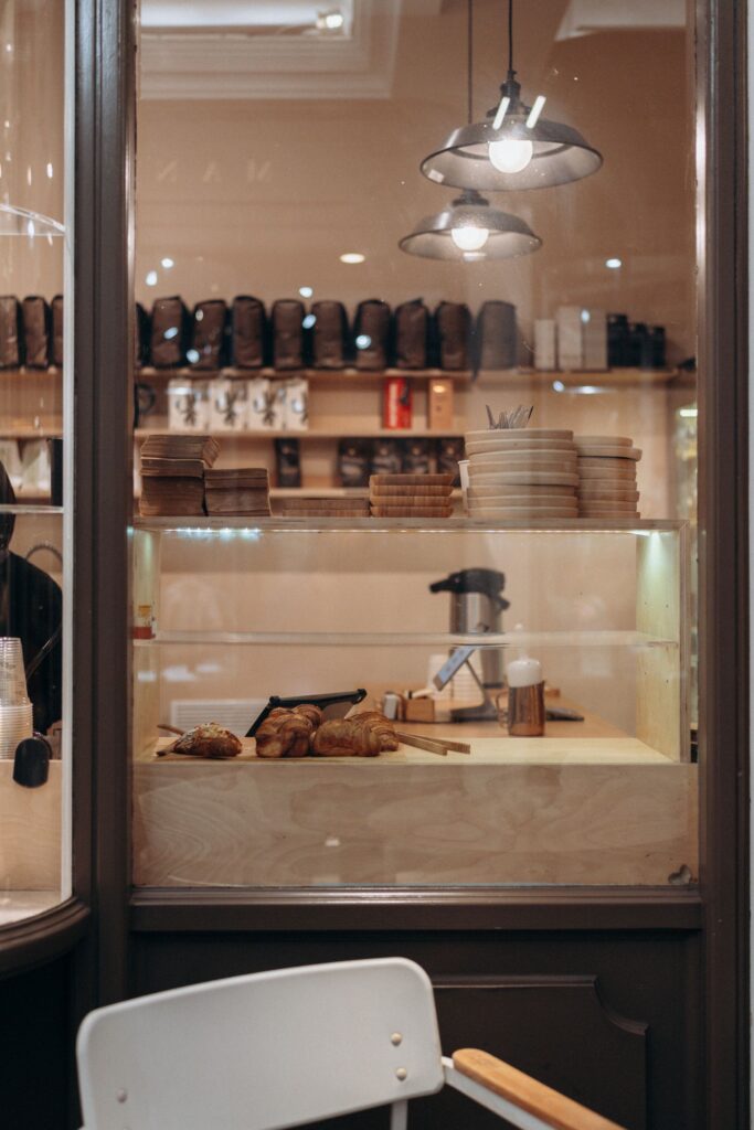 View through the café doorway to the counter and a hanging lamp