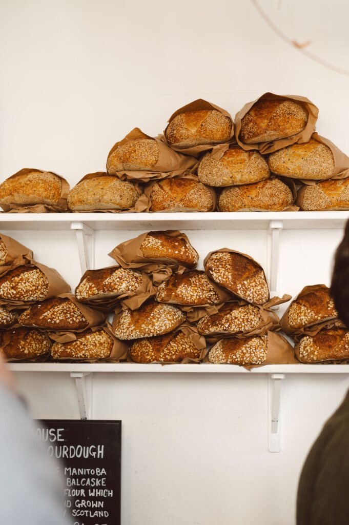 White shelves of round crusty loaves