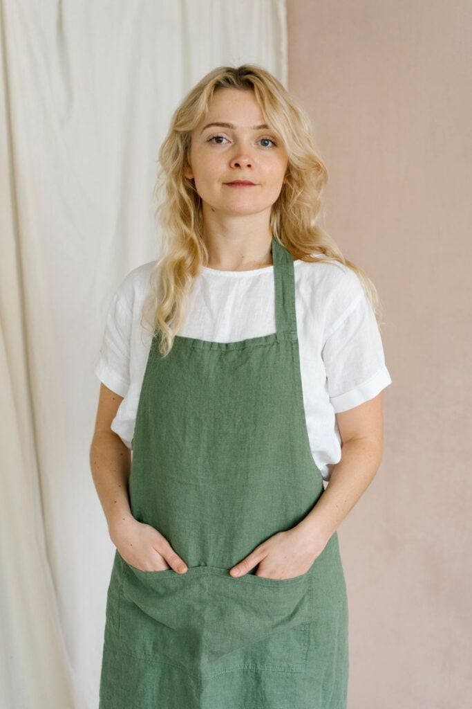 Ingrid, head baker, in a green apron