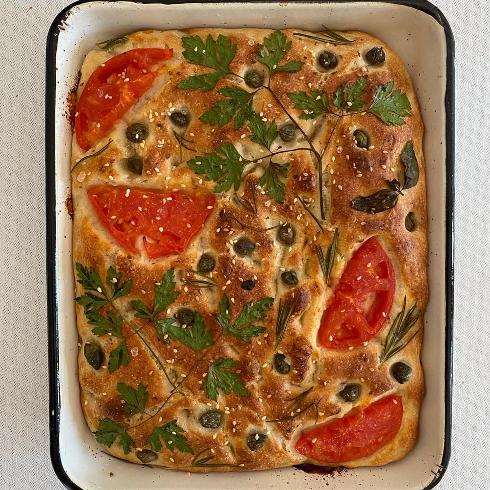 Tomato focaccia in a baking tray