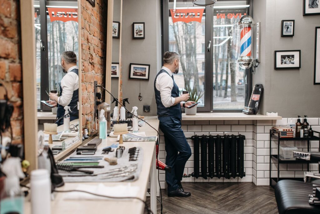 Barber preparing his station by a large window