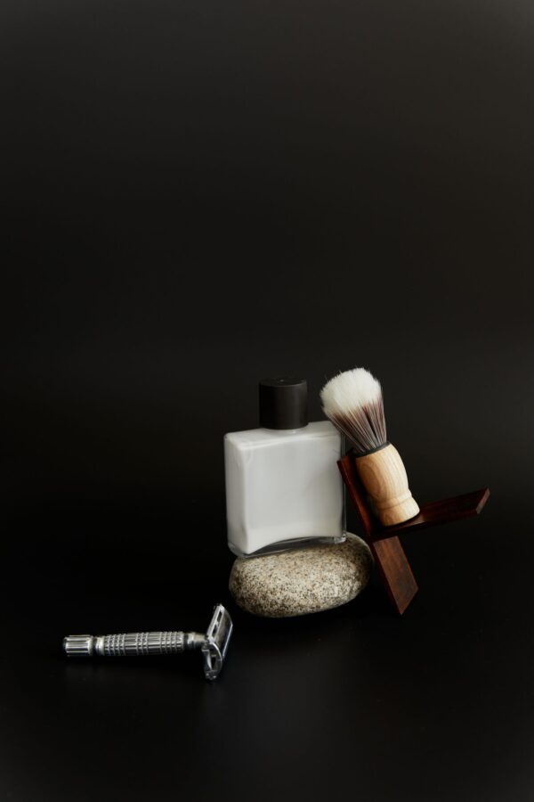 Shave set arranged on a stone with the razor in front