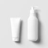 White tube and pump bottle on a white surface