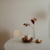 Minimalist interior with a small candle on a table