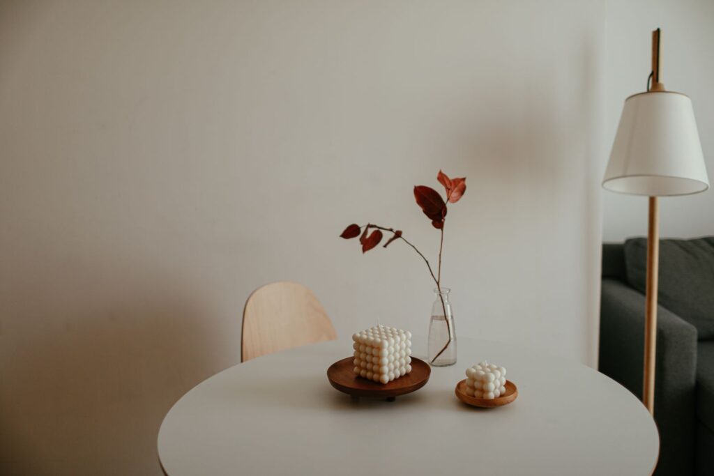 Minimalist interior with a small candle on a table