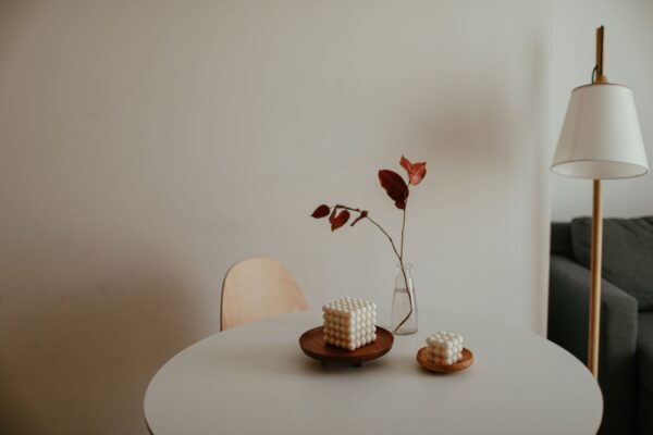 Minimalist interior with a small candle on a table