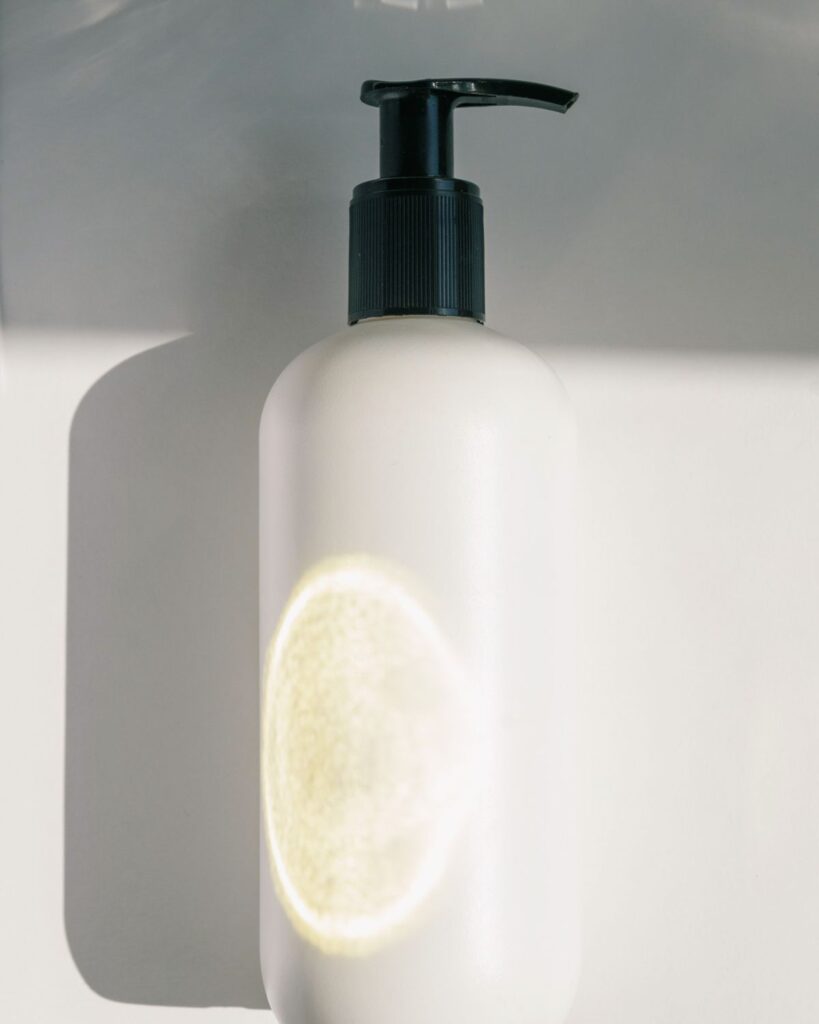 Close-up of a white pump bottle in soft light