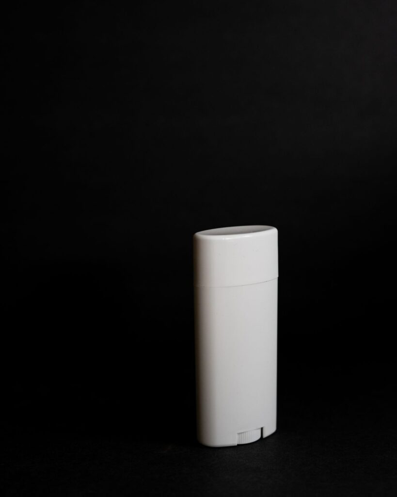 White deodorant stick on a black background