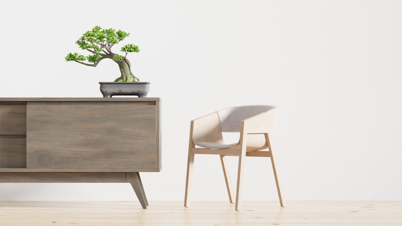Buffet cabinet styled with a bonsai and chair