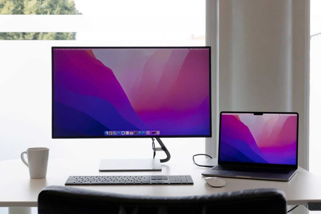 Monitor on a wooden desk shelf