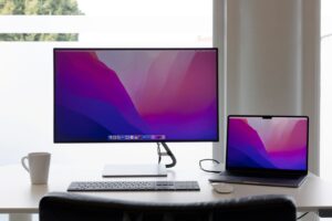 Monitor on a wooden desk shelf