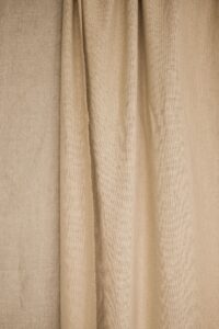 Beige linen curtain in soft light