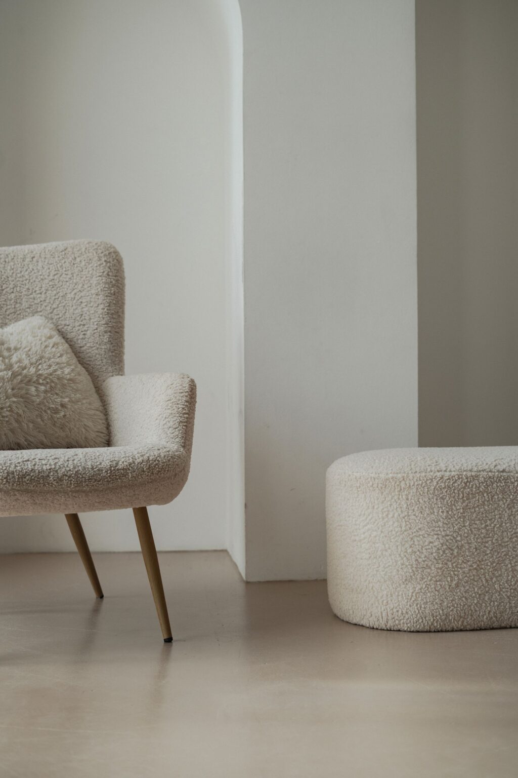 Boucle lounge chair and matching pouf