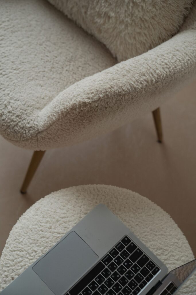 Close-up of the boucle weave and tapered oak leg