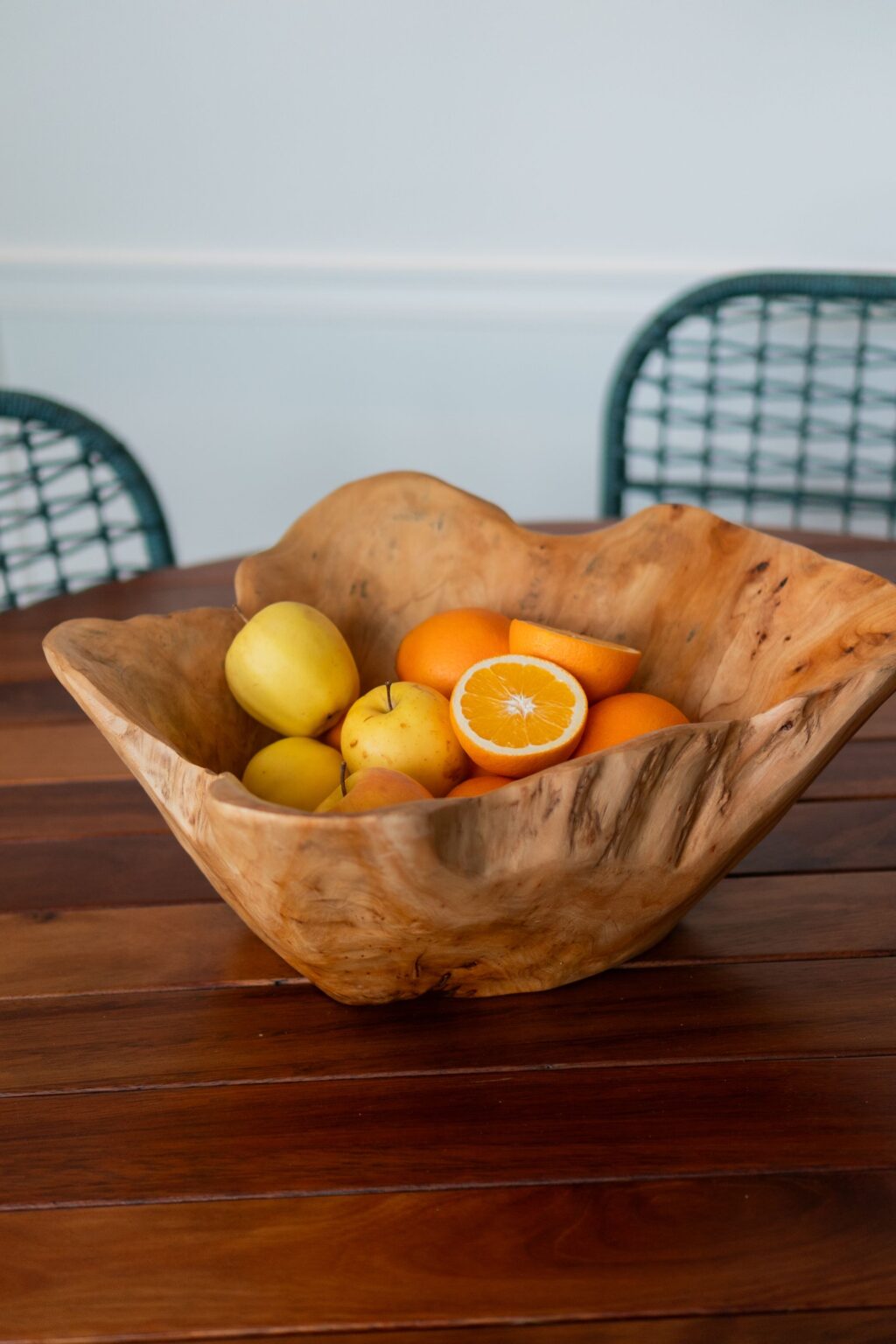Oiled table top with a wooden fruit bowl
