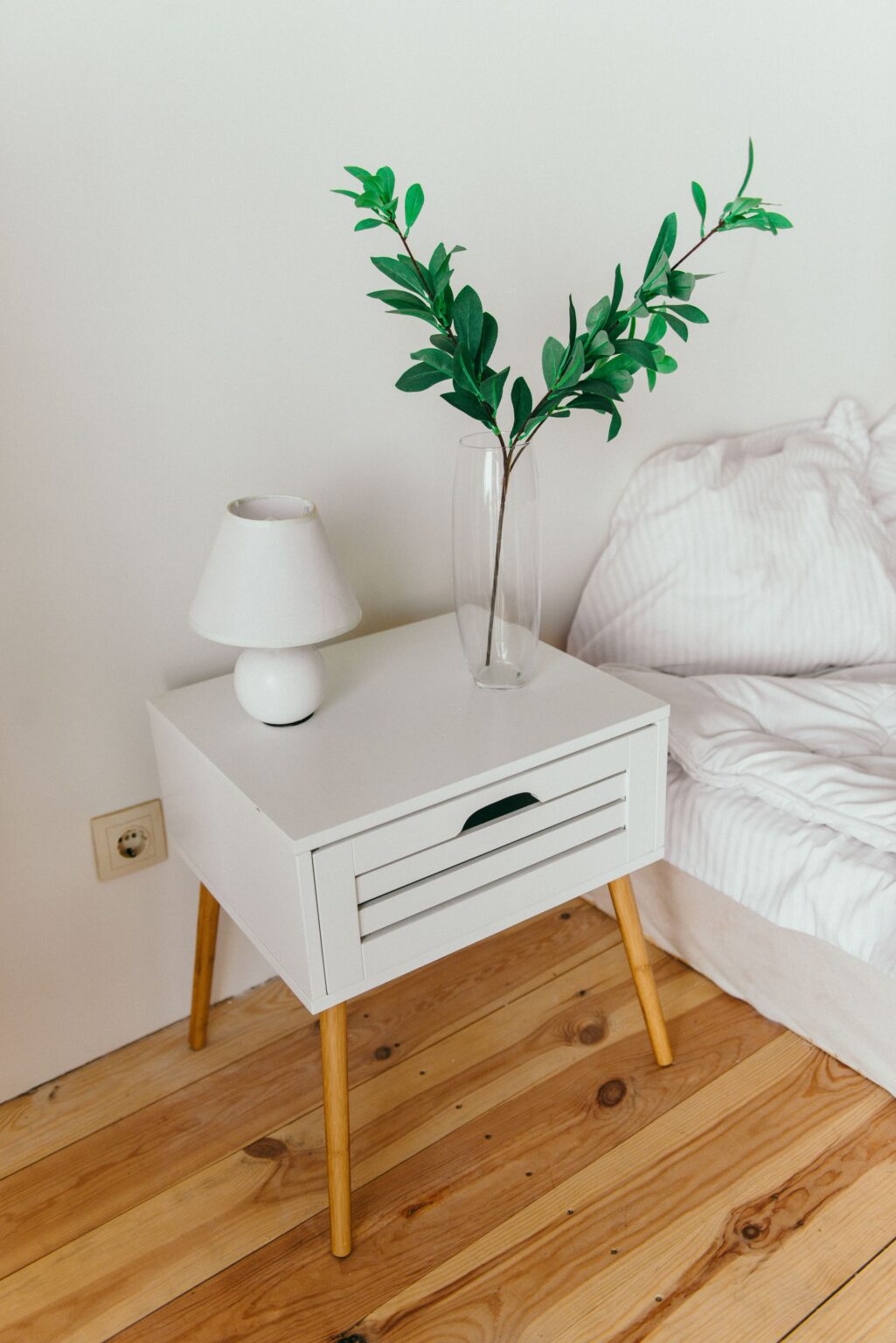 Two-drawer nightstand beside the bed