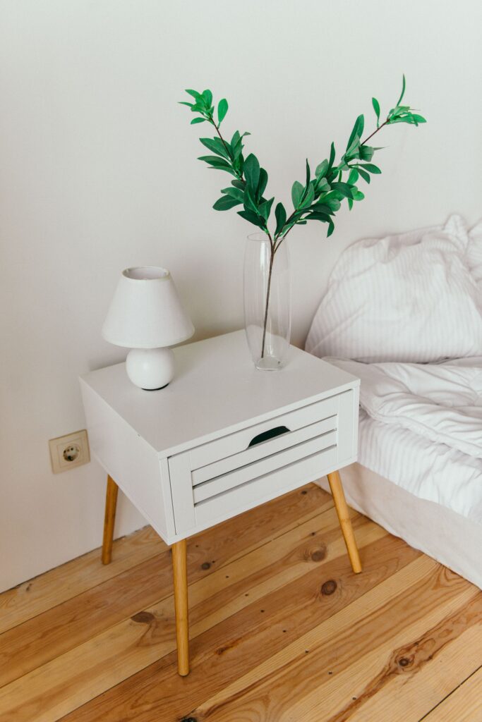 Two-drawer nightstand beside the bed