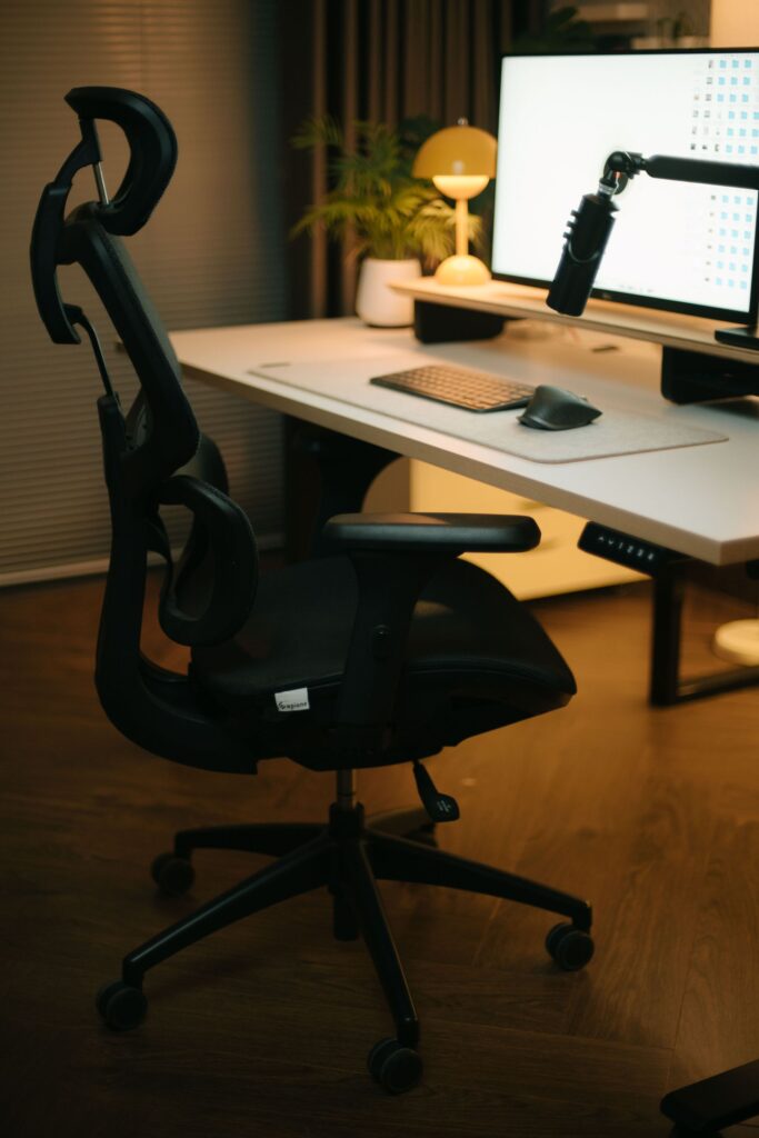 Ergonomic office chair at a height-adjustable desk