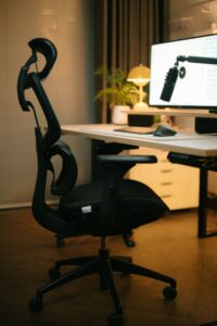 Black ergonomic office chair at a bright desk