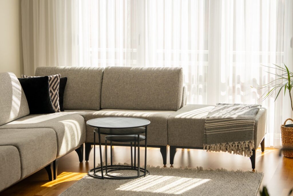 Grey sectional sofa in a sunlit living room