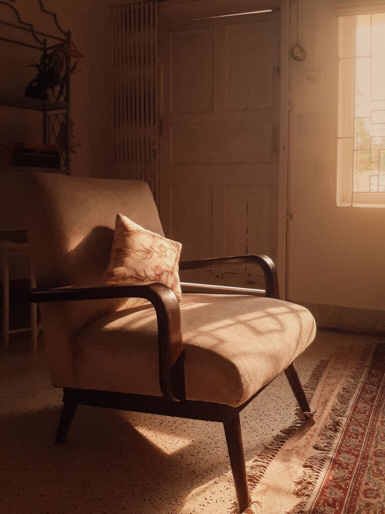 Bentwood armchair with a cushion in warm evening light