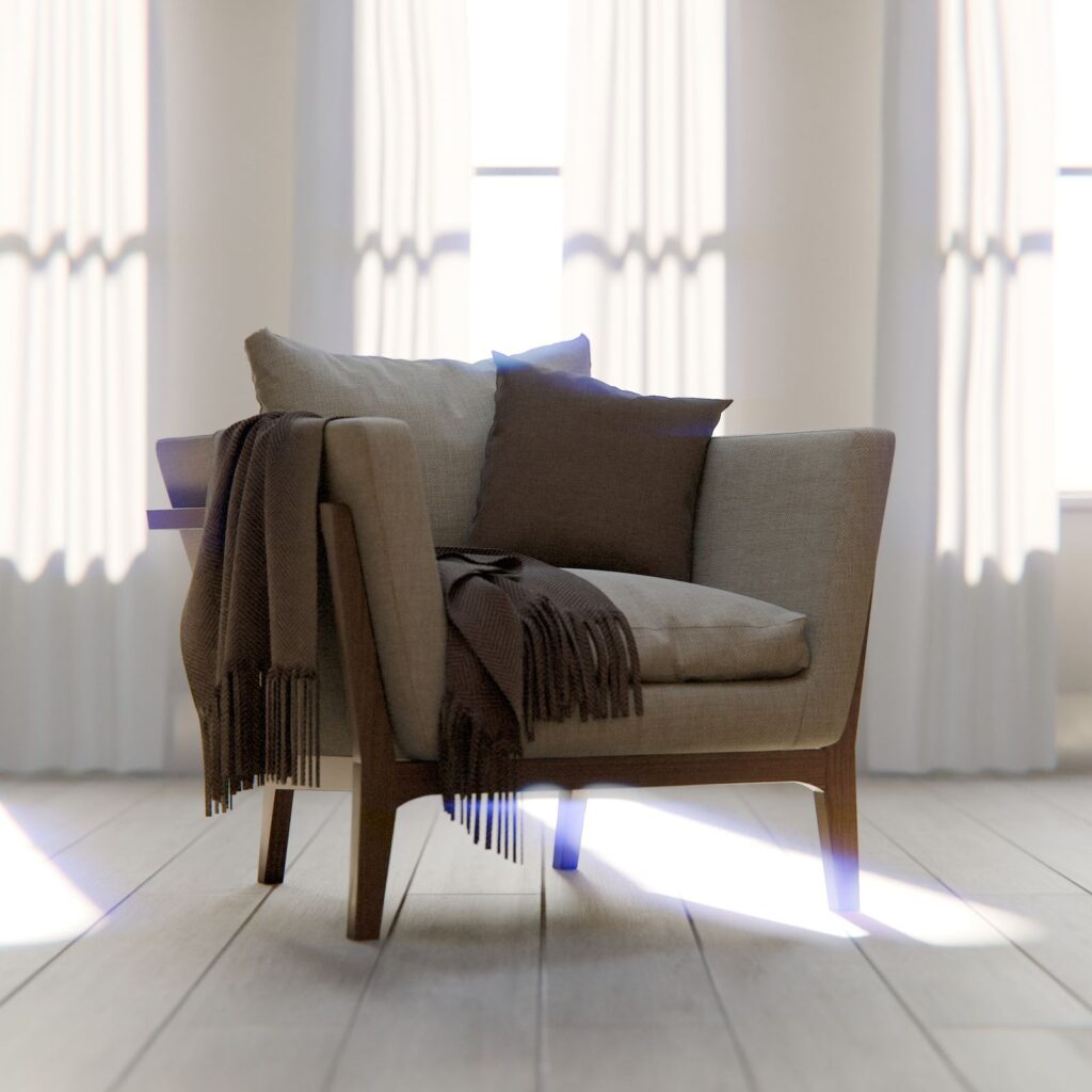 Beige lounge chair with a throw in sunlight