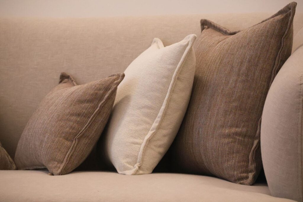Neutral cushions on a sofa