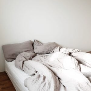 Crumpled beige linen sheets