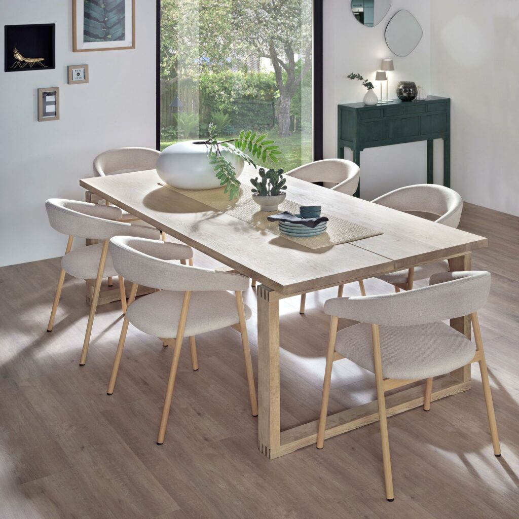 Six upholstered dining chairs around an oak table