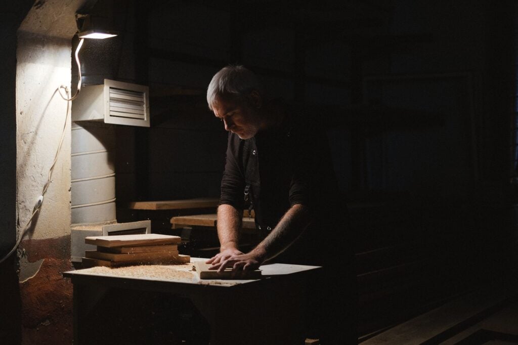 Craftsman working at a bench in a wood workshop