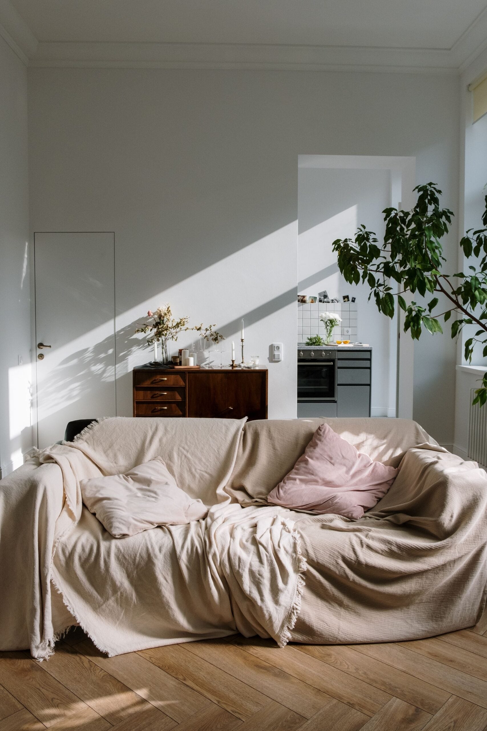 Linen-covered sofa in a sunlit apartment