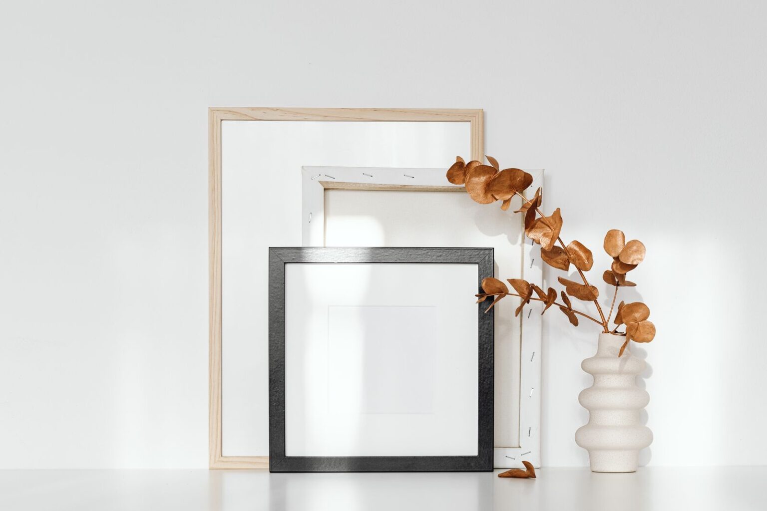 Two minimalist framed prints with dried flowers
