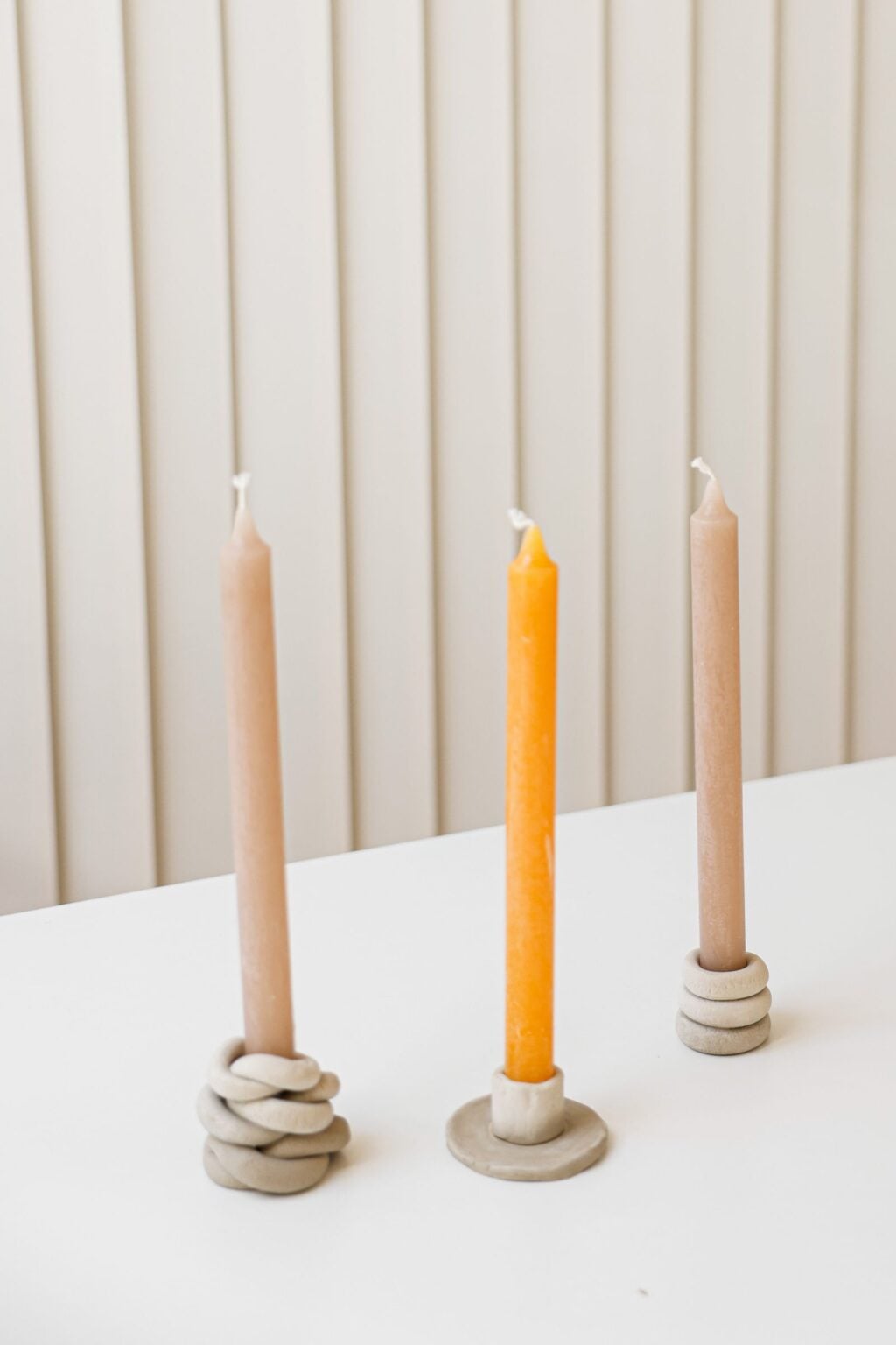 Tapered candles in minimal holders