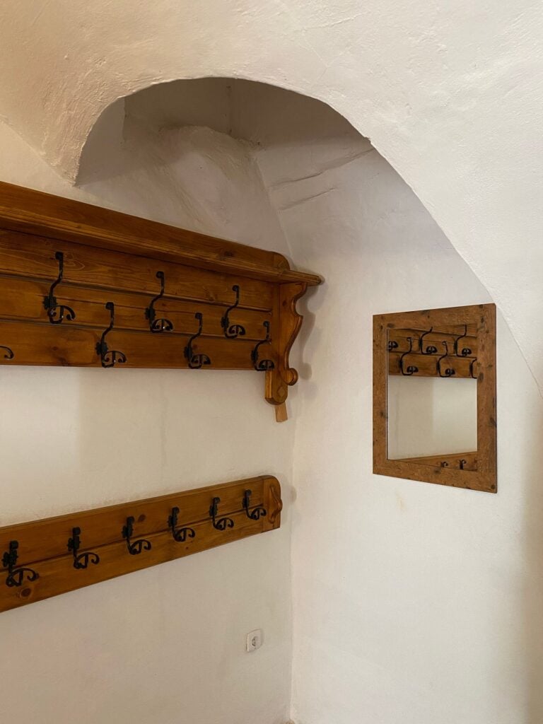 Wooden wall-mounted coat rack with hooks