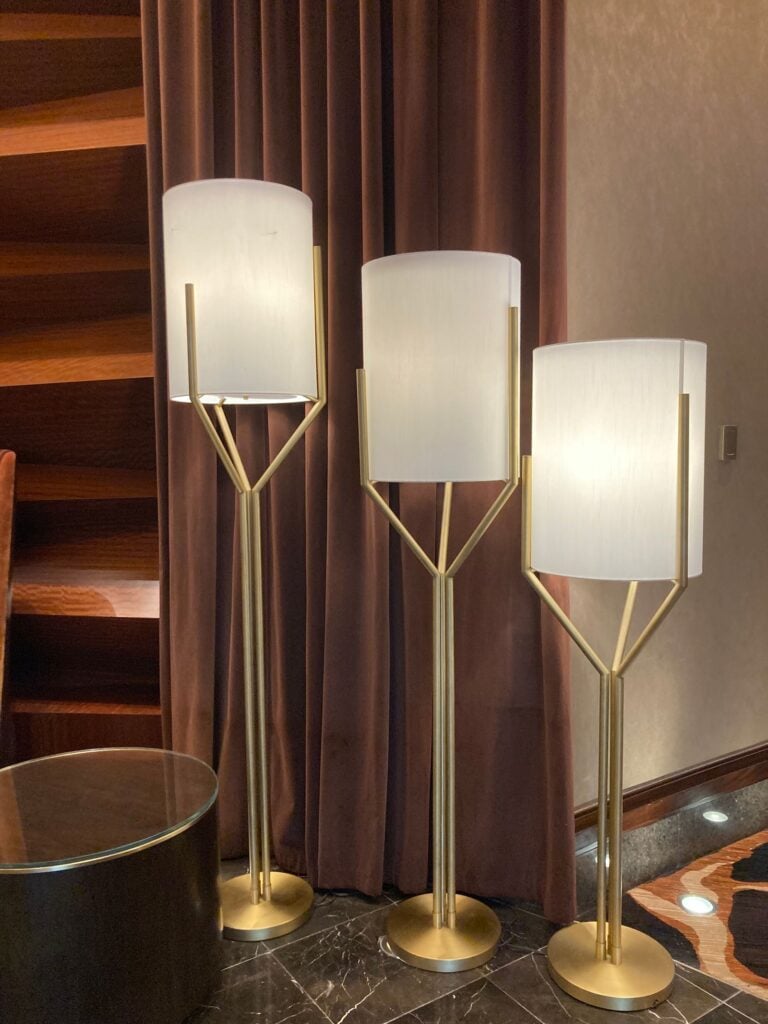 Trio Floor Lamp with three opal cylinders on brass stems