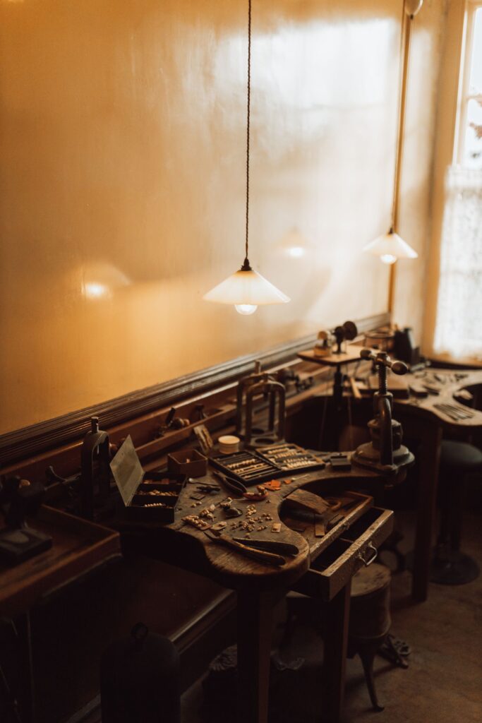 An old workbench under a warm pendant light