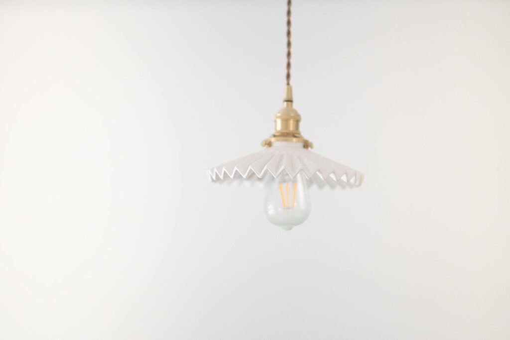 Frill Glass Pendant with a scalloped shade and brass cap