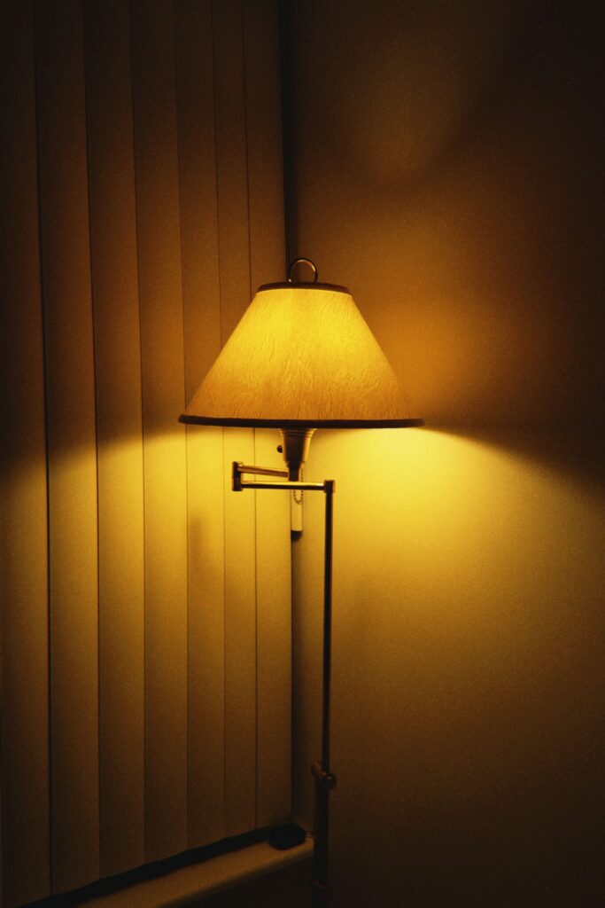 Swing Floor Lamp with a cotton shade on a swing arm