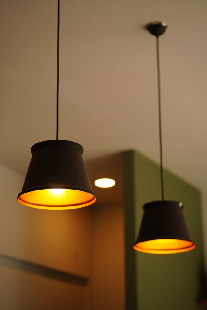 Lykt Pendants in black steel with a warm glow inside